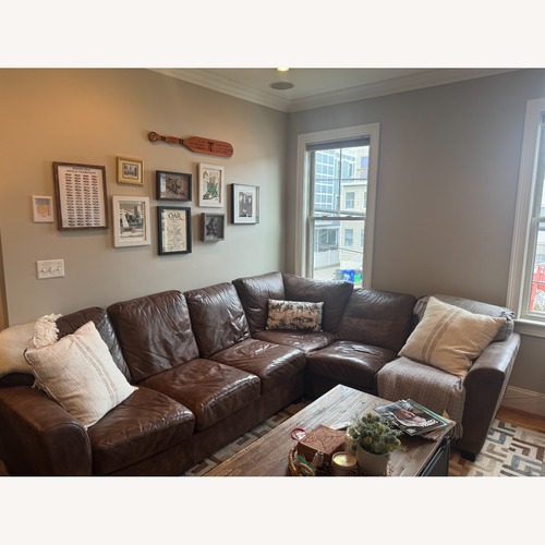 Used Dark Brown Leather 2 Piece Sectional for sale on AptDeco