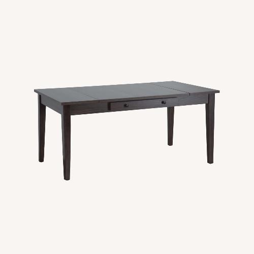 Used Dark Brown Wood Dining Table for sale on AptDeco