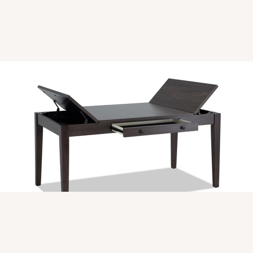 Used Dark Brown Wood Dining Table for sale on AptDeco