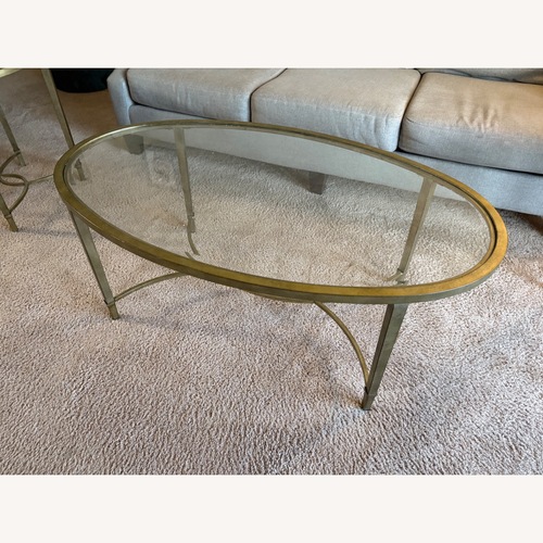 Used Raymour & Flanigan Copia Oval Glass Coffee Table for sale on AptDeco