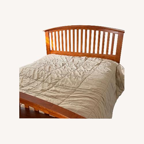 Used Raymour & Flanigan Light Brown Queen Bed for sale on AptDeco