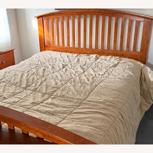Used Raymour & Flanigan Light Brown Queen Bed for sale on AptDeco