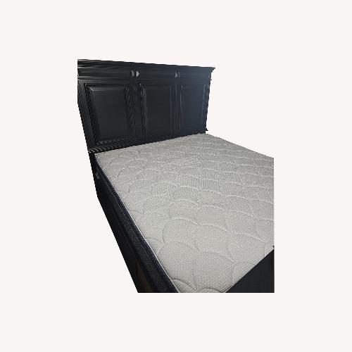 Used Bob's Discount Furniture Dark Brown Wood King Bed for sale on AptDeco