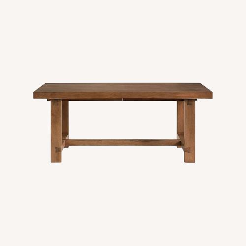 Used Pottery Barn Reed Dark Brown Wood Dining Table for sale on AptDeco