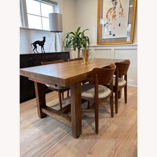 Used Pottery Barn Reed Dark Brown Wood Dining Table for sale on AptDeco