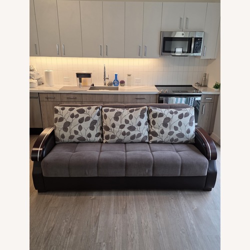 Used Light Brown Wood Sleeper Sofa for sale on AptDeco