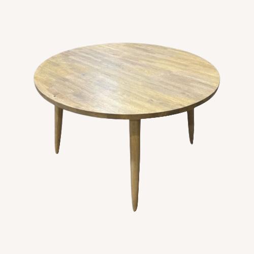 Used Round Wood Tapered Legs Dining Table for sale on AptDeco