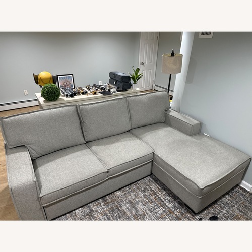 Used Light Gray Two Seater Sofa With Chaise Lounge for sale on AptDeco