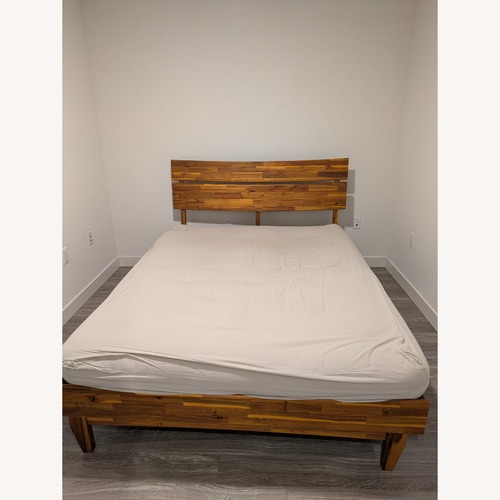 Used The Futon Shop Natural Wool Queen Bed for sale on AptDeco