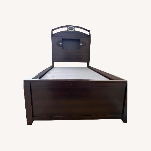 Used Rooms To Go Dark Brown Wood Daybed for sale on AptDeco