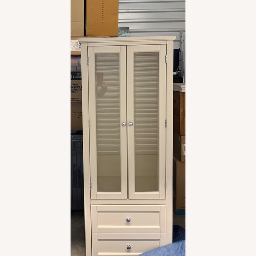 Used Pottery Barn White/Cream Wood Armoire for sale on AptDeco