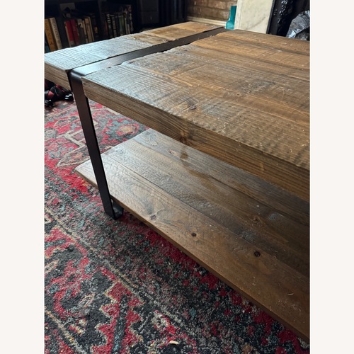 Used Dark Brown Industrial Coffee Table for sale on AptDeco