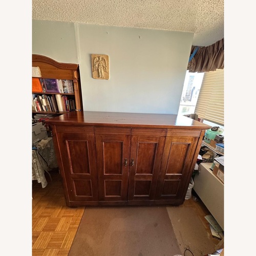 Used Vintage/Antique Dark Brown Armoire for sale on AptDeco