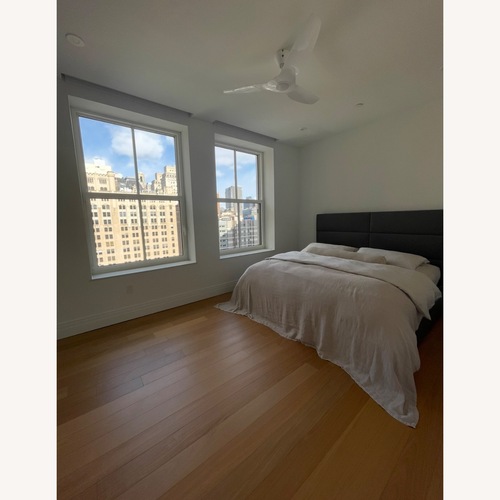 Used Modani Cama Dark Gray Faux Leather King Bed for sale on AptDeco