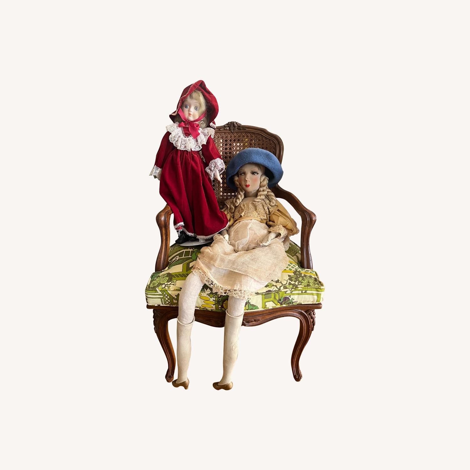 Seated 2 Antique Dolls on Wooden Chair - image-0