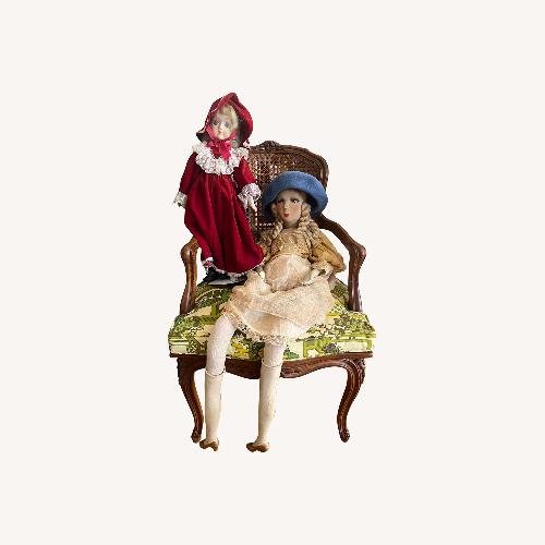 Used Seated 2 Antique Dolls on Wooden Chair for sale on AptDeco