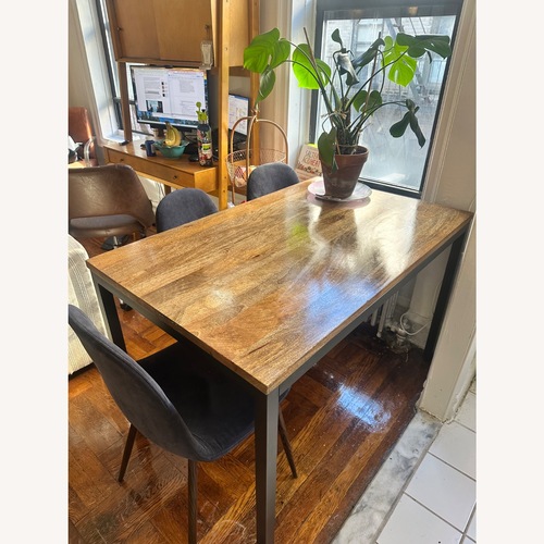 Used Dark Brown Wood Dining Table and 3 Chairs for sale on AptDeco