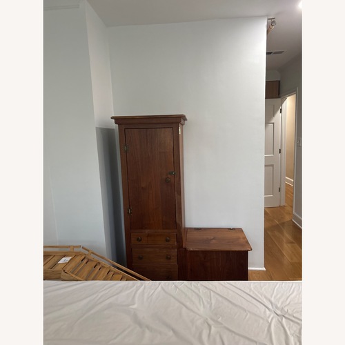 Used Vintage/Antique Dark Brown Wood Armoire for sale on AptDeco