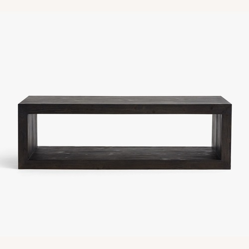 Used Pottery Barn Folsom Black Wood Coffee Table 58” for sale on AptDeco