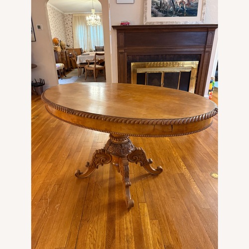 Used Antique Carved Oval Dining Table Solid Wood for sale on AptDeco