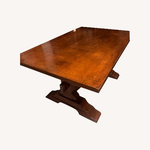 Used Dark Brown Wood Dining Table for sale on AptDeco