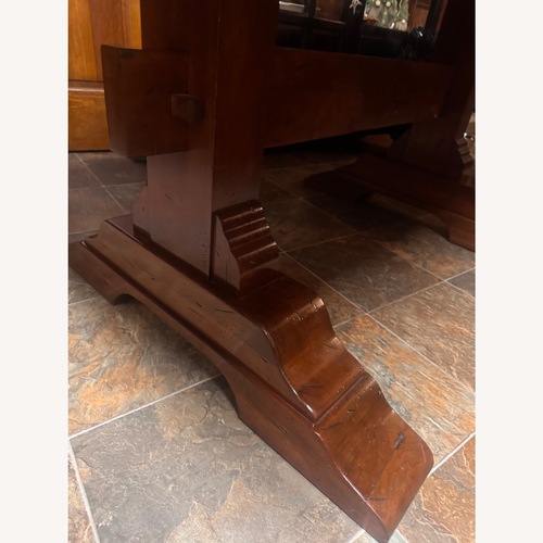 Used Dark Brown Wood Dining Table for sale on AptDeco