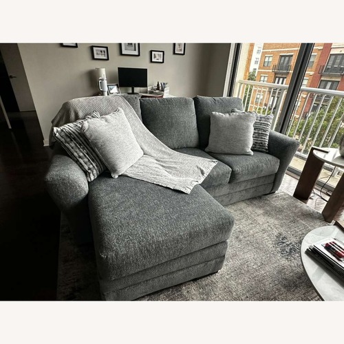 Used Ashley Furniture Dark Gray Sleeper Sofa for sale on AptDeco