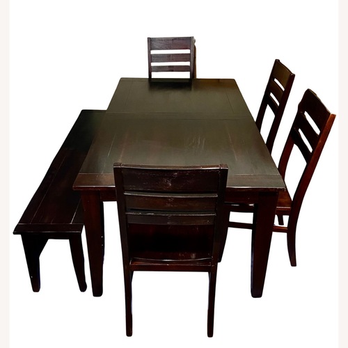 Used World Market Dark Brown Wood 6-Piece Dining Set for sale on AptDeco