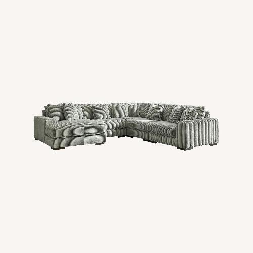 Used Raymour & Flanigan Dark Gray 3+ Piece Sectional for sale on AptDeco