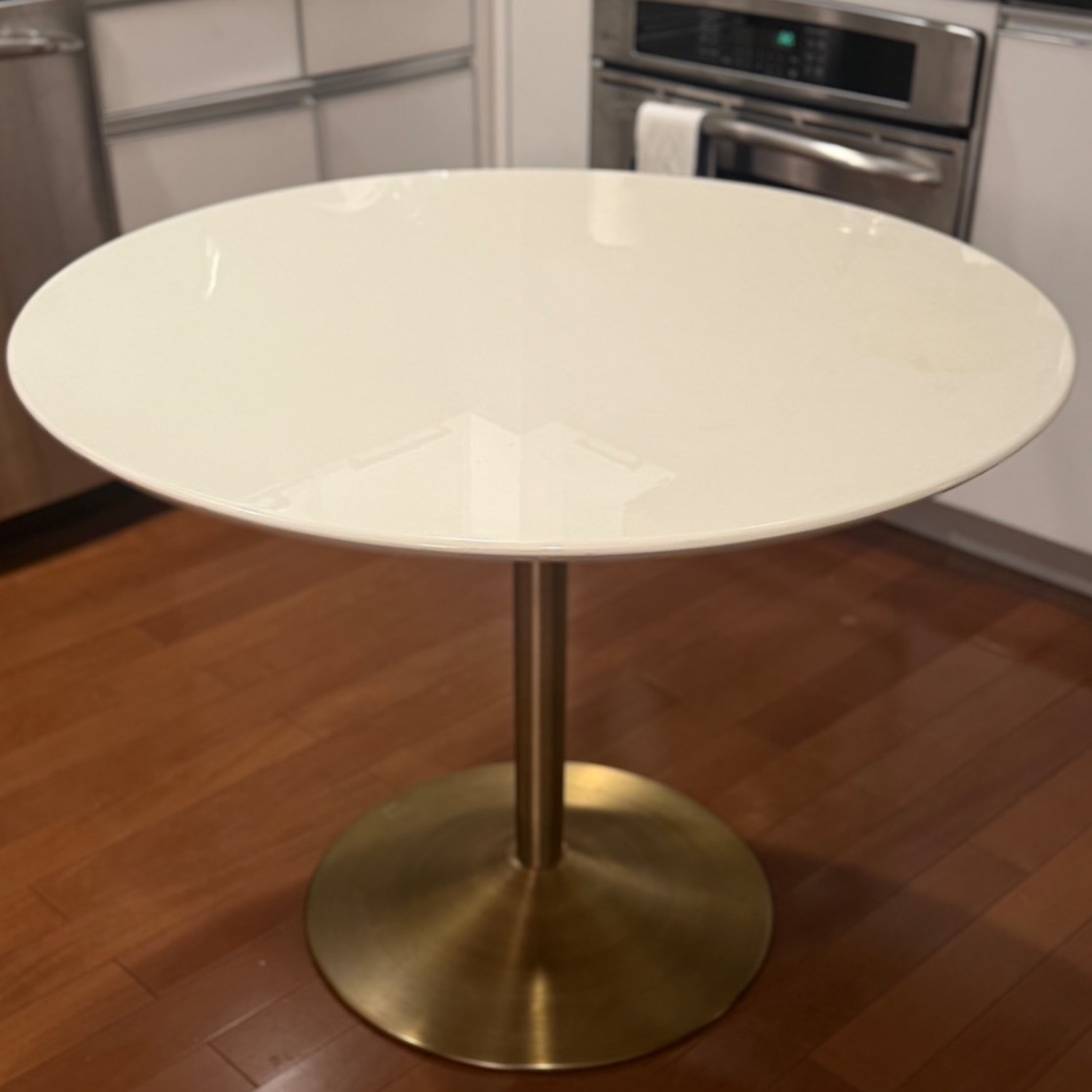 CB2 Odyssey Round White Dining Table w  Brass Base - image-5