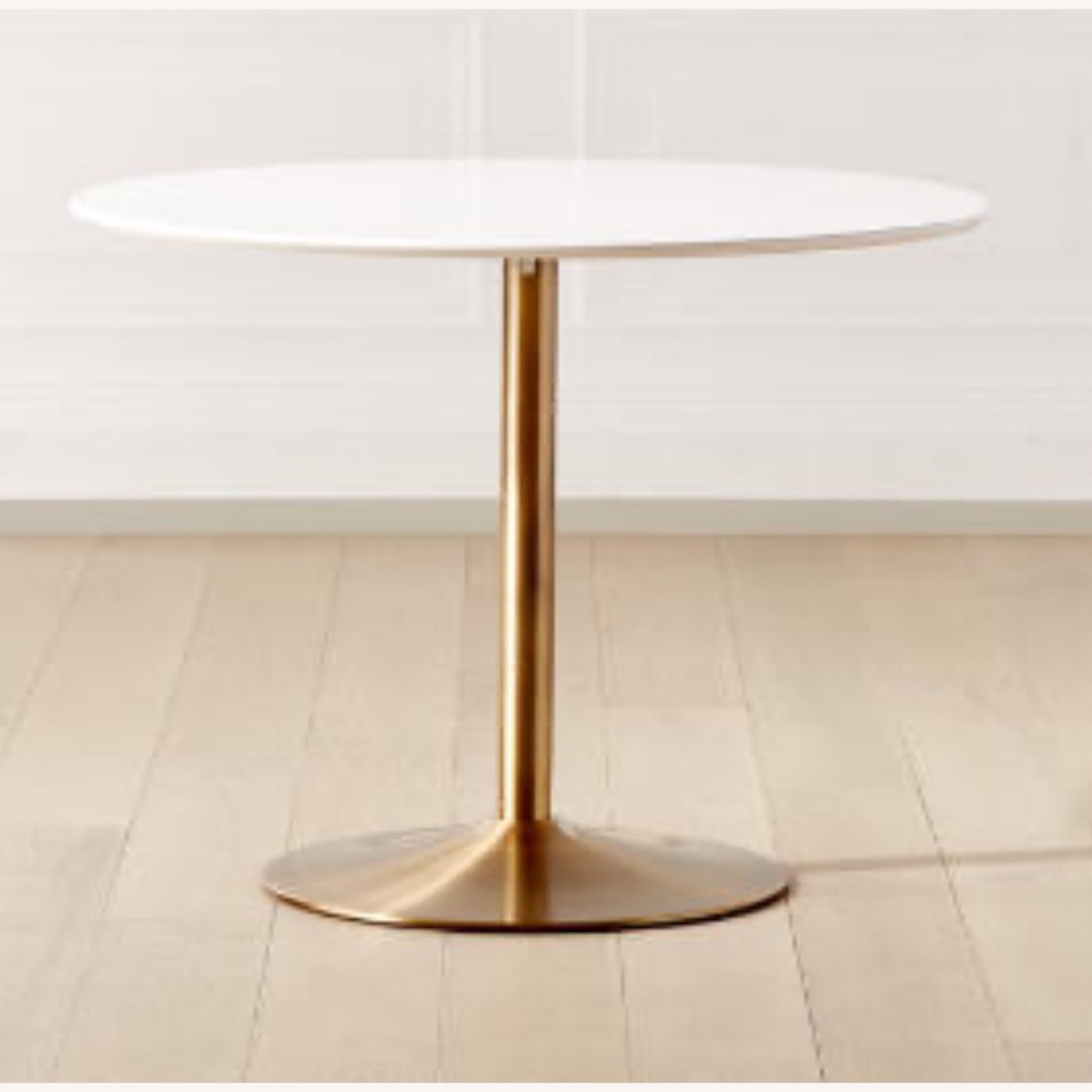 CB2 Odyssey Round White Dining Table w  Brass Base - image-0