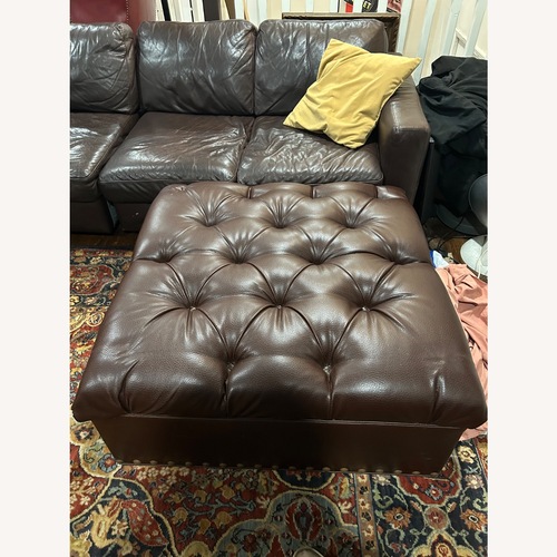 Used Dark Brown Leather Ottoman for sale on AptDeco