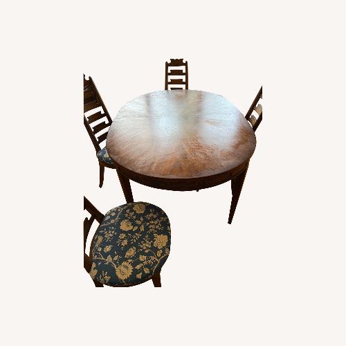 Used Dining Table with 3 Leaves and 4 Chairs for sale on AptDeco