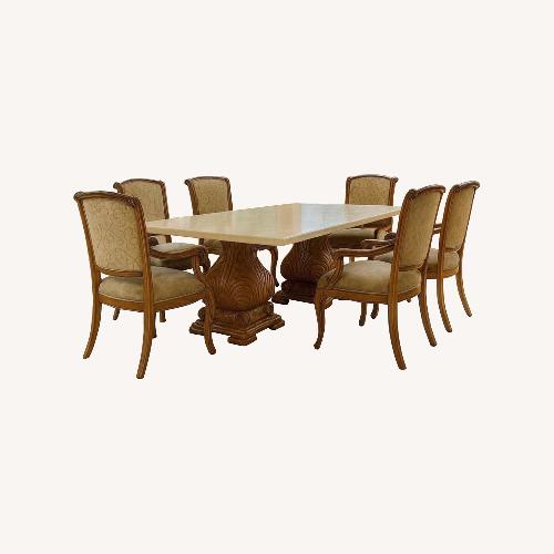 Used Kreiss Fleur De Lis Dining Table - Stone-Top for sale on AptDeco