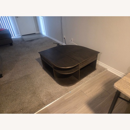 Used  Dark Brown Wood Lift Top Cocktail Table for sale on AptDeco