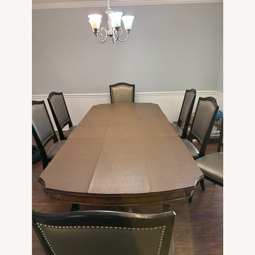 Used Dark Brown Dining Table for sale on AptDeco