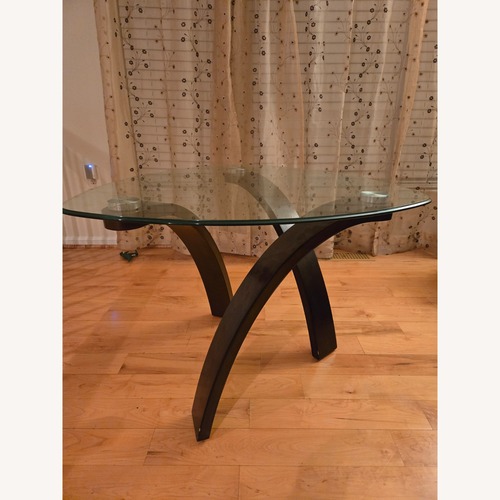 Used Ashley Furniture Dark Brown Glass Coffee Table for sale on AptDeco