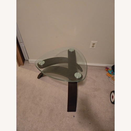 Used Ashley Furniture Dark Brown Glass Coffee Table for sale on AptDeco