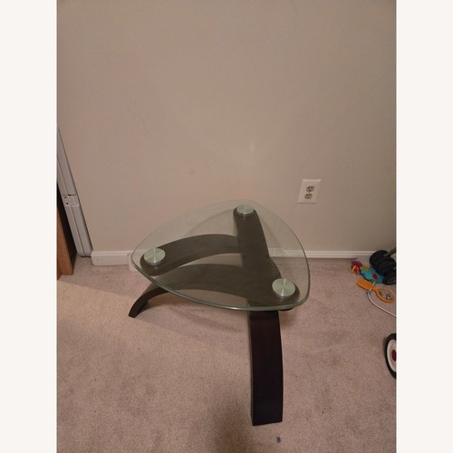 Used Ashley Furniture Dark Brown Glass Coffee Table for sale on AptDeco