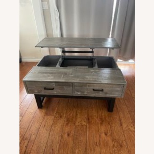 Used Ashley Furniture Light Gray Wood Coffee Table for sale on AptDeco