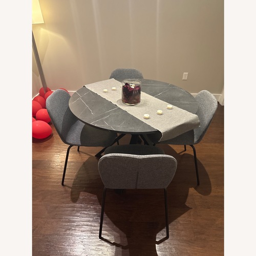 Used IKEA Dark Gray Wood Dining Table with Chairs for sale on AptDeco