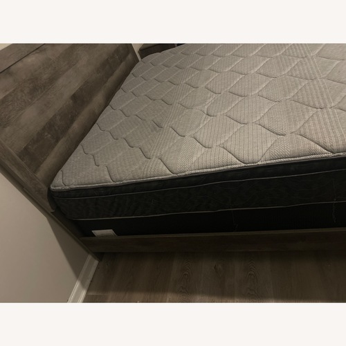 Used Serena & Lily Dark Gray Wood King Bed for sale on AptDeco