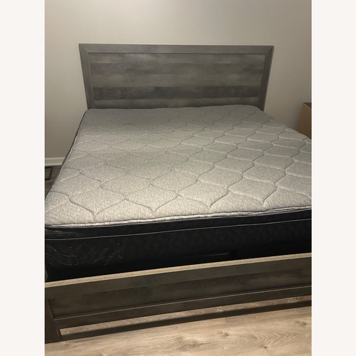 Used Serena & Lily Dark Gray Wood King Bed for sale on AptDeco