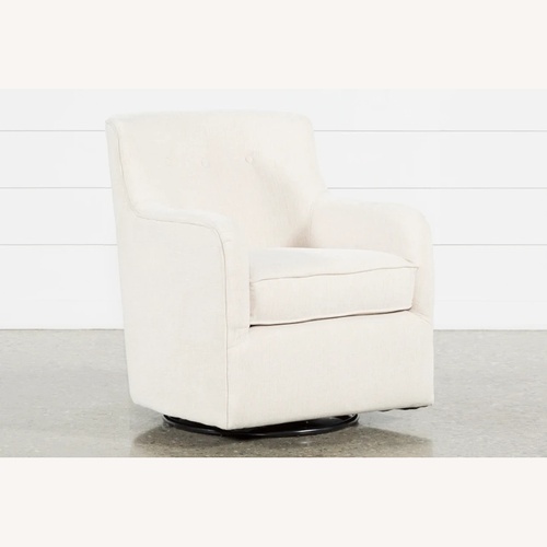 Used Living Spaces Fabric Swivel Glider Nursing Chair for sale on AptDeco