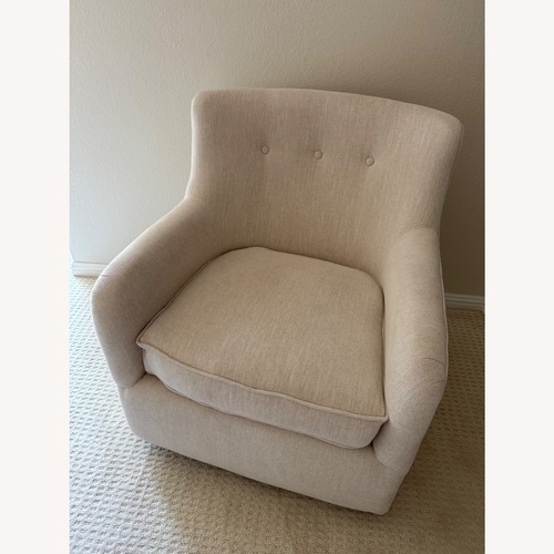 Used Living Spaces Fabric Swivel Glider Nursing Chair for sale on AptDeco