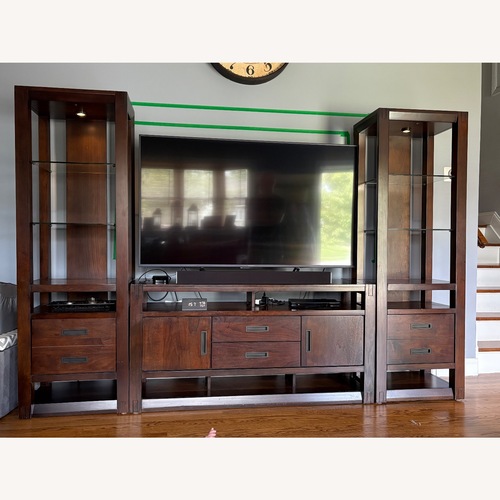 Used Raymour & Flanigan Dark Brown Wood Media Storage for sale on AptDeco