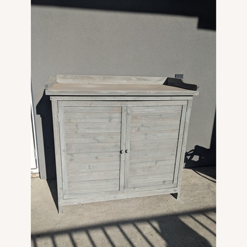 Used Light Gray Wood Outdoors Storage or Potting Bench for sale on AptDeco