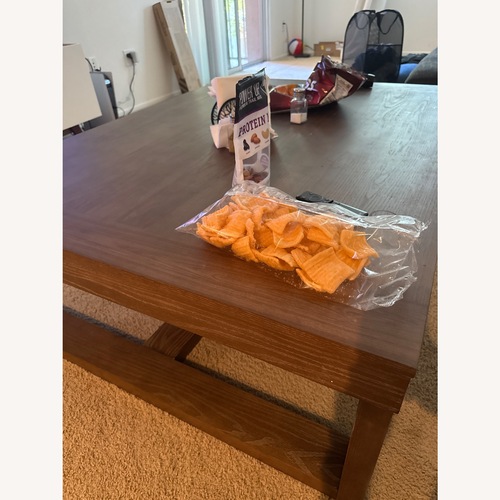 Used Ashley Furniture Dark Brown Wood Coffee Table for sale on AptDeco