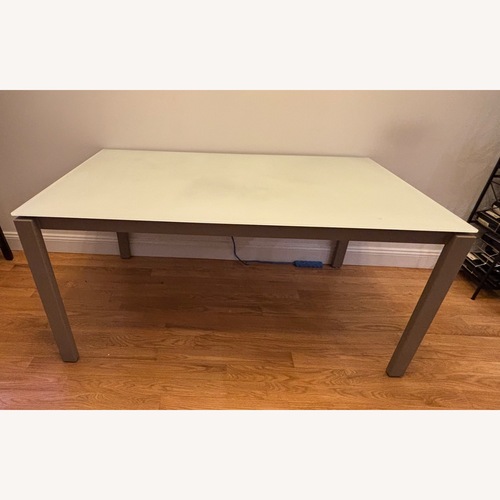 Used Tempered Glass and Metal Dining Table for sale on AptDeco