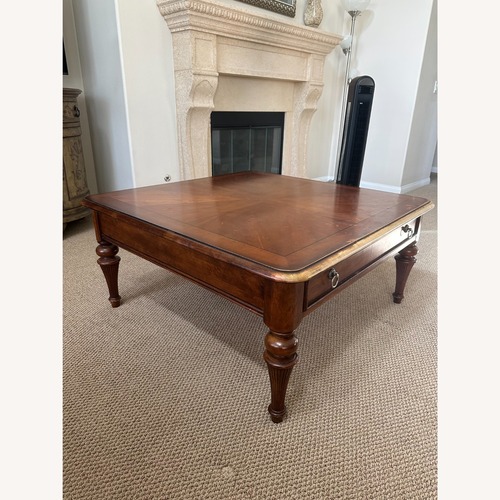 Used Dark Brown Wood Coffee Table for sale on AptDeco